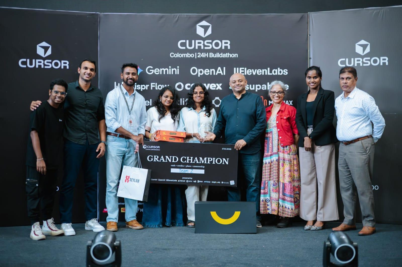 Team Z on stage holding the Grand Champion sign at the Cursor Colombo 24-Hour Buildathon